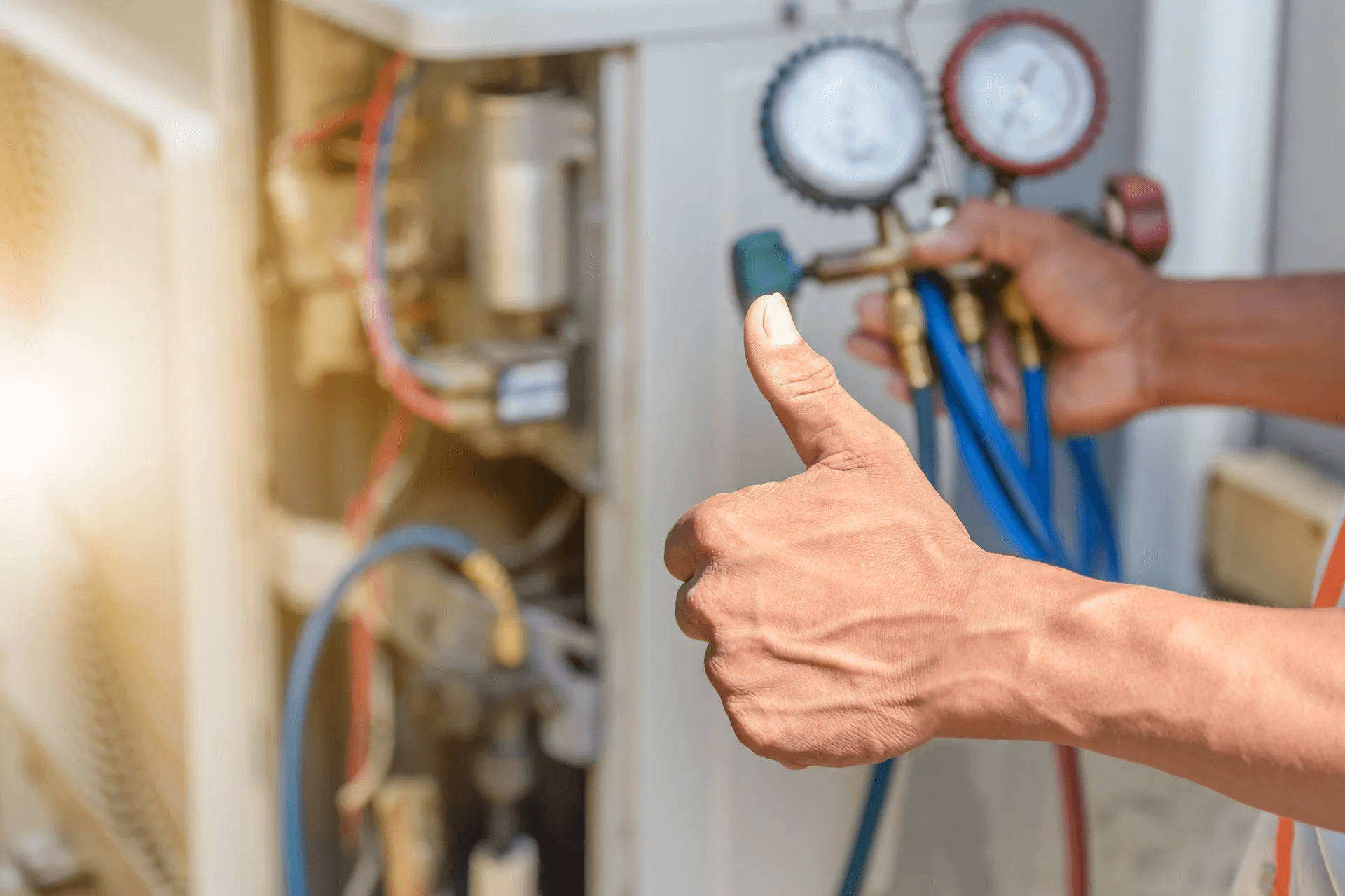 a man's hand in the air giving a thumbs up