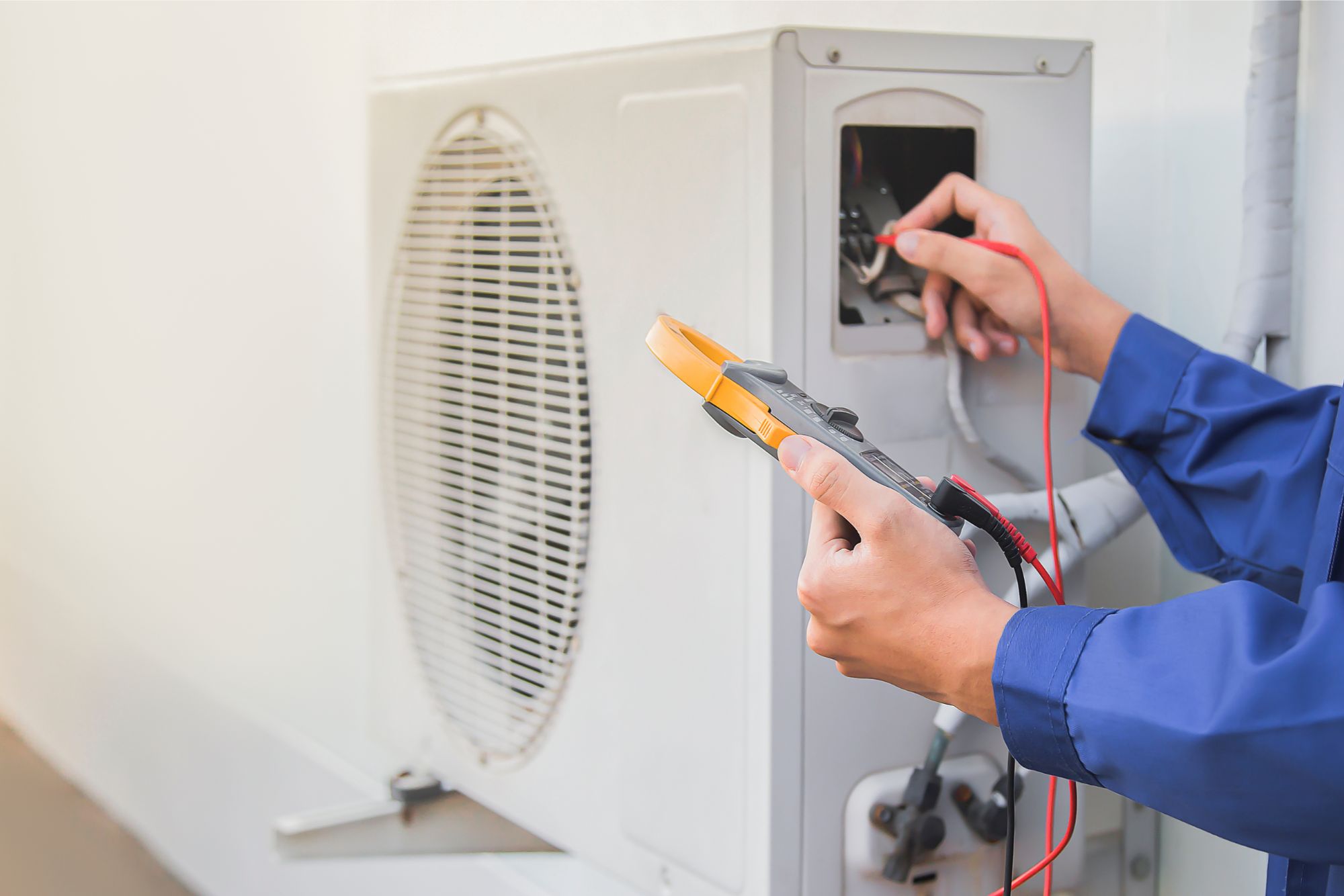 a man working on an hvac system