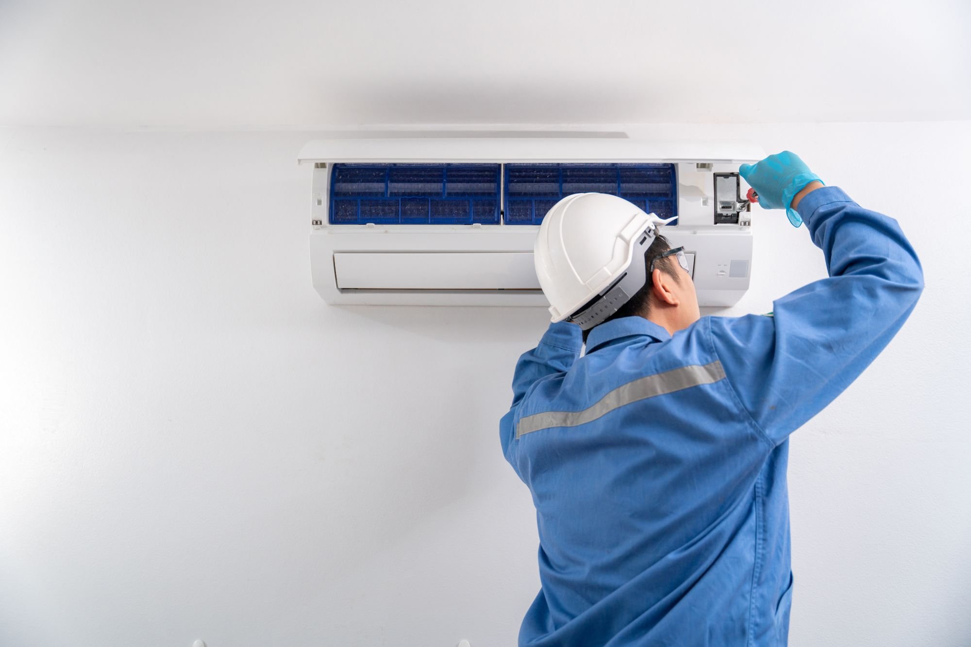 HVAC technician explaining AC replacement cost to Sacramento homeowner during in-home consultation