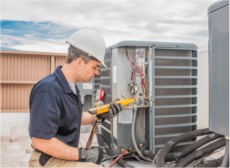 an elite heating and air hvac service technician performing hvac maintenance on a unit